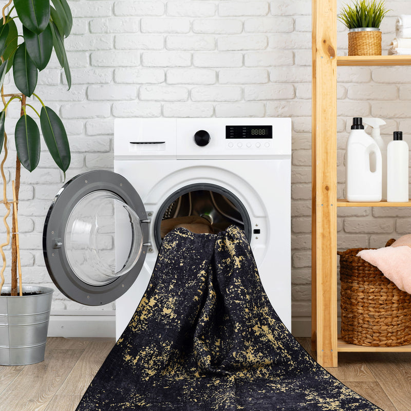 Maval - 8' X 10' Washable Area Rug - Black / Gold
